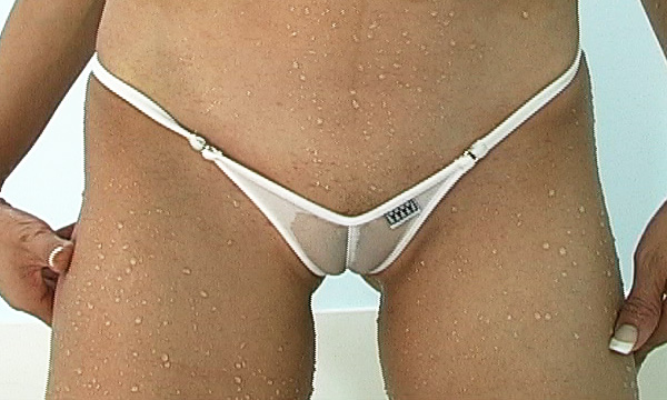 Ariel Andrews wearing a sheer white cameltoe micro thong